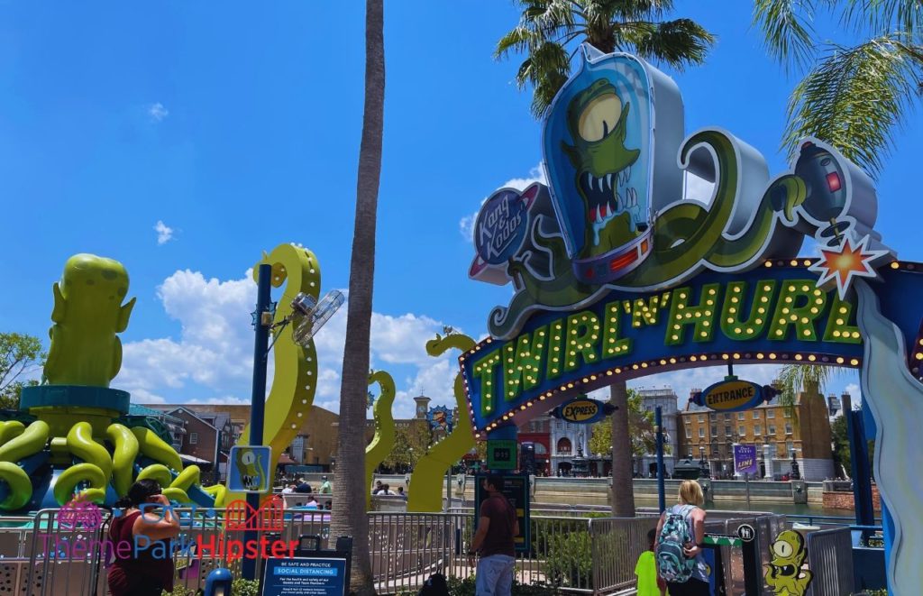 Twirl n Hurl ride in Simpsons Land at Universal Orlando with ride height sign advising of height requirements out front. Keep reading to discover 10 things to know before you go to Universal Orlando Resort in 2024.