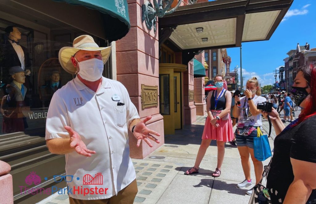 VIP Tour Guide at Universal Studios Florida with guests taking photos. Keep reading to learn all the best things to do on a Universal Studios solo trip. 