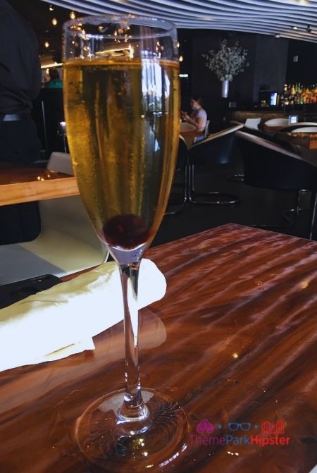Flute of champagne at STK. Keep reading to find out all there is to know about STK Orlando.