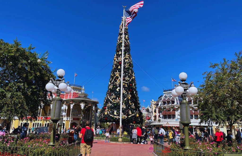 Christmas Tree in Main Street USA Magic Kingdom. Keep reading to get the best Disney Christmas shirts!