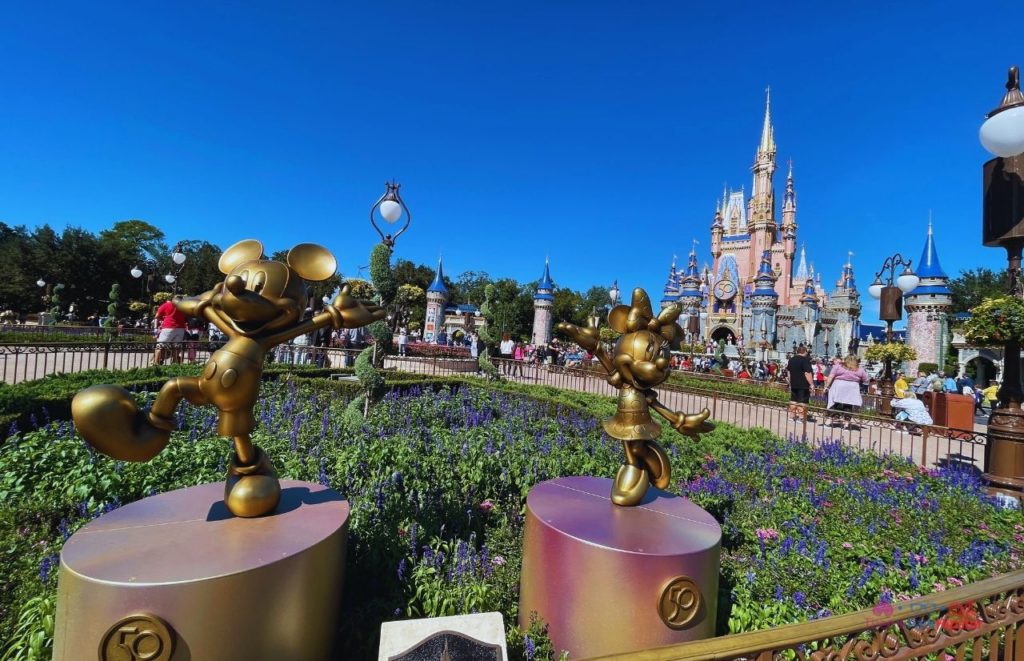 Cinderella Castle for 50th Anniversary Celebration with the Gold Statues of Mickey Mouse and Minnie Mouse. One of the best place to watch Magic Kingdom Happily Ever After fireworks. 