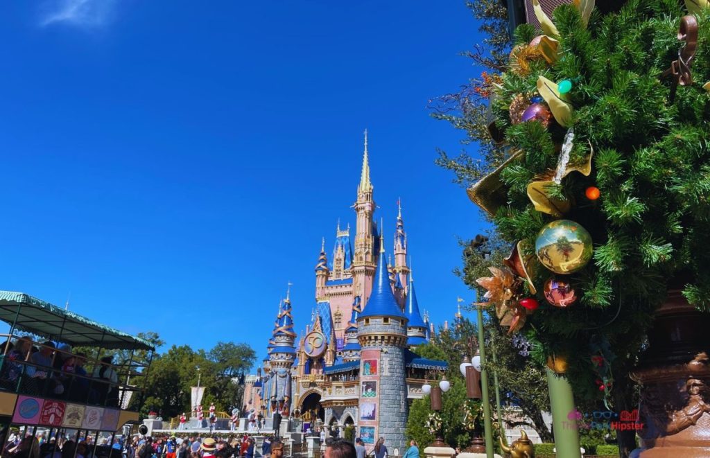 Cinderella Castle for 50th Anniversary Celebration with the Omnibus. Keep reading to learn more about your Disney Christmas trip and the Disney Christmas decorations.