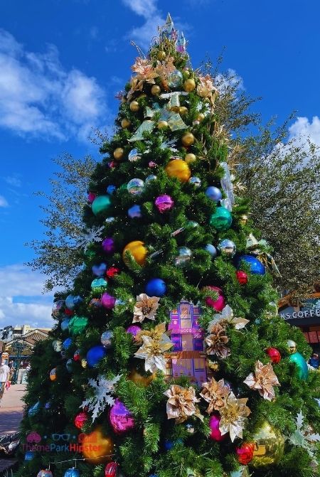 Disney Parks Christmas Tree on Disney Springs Christmas Tree Trail. Keep reading to get the best Disney Christmas pictures and to know where to take the best Christmas photos at Disney World!