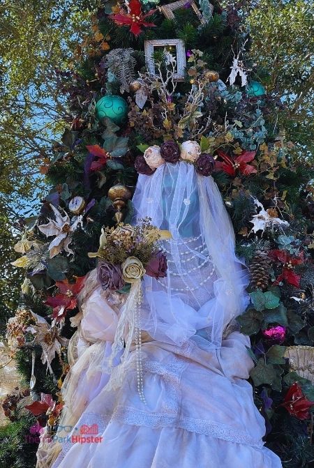 Disney Springs Christmas Tree Trail Haunted Mansion Stop. Keep reading to learn about the best Disney Christmas trees!