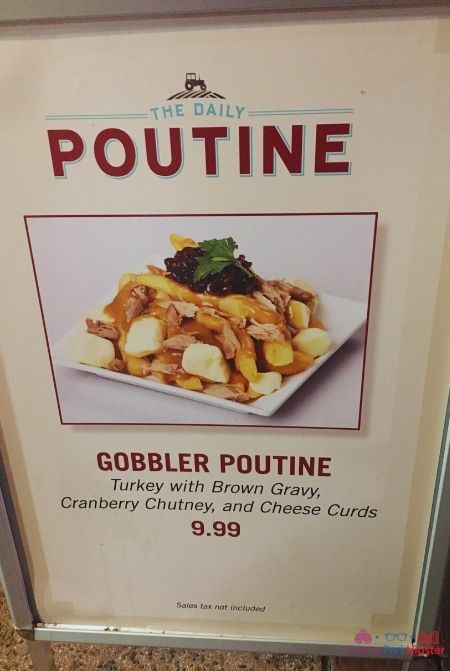 Disney Springs the Daily Poutine Gobbler Poutine with Turkey Brown Gravy Cranberry Chutney and Cheese Curds for Thanksgiving and Christmas. Keep reading to get your perfect Disney Resort Christmas Decorations Tour!