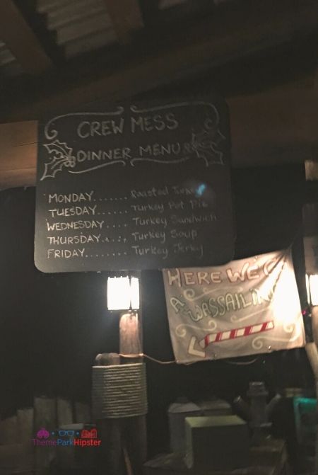 Jingle Cruise Queue with Menu at Magic Kingdom. Keep reading to get the best Disney Christmas pictures and to know where to take the best Christmas photos at Disney World!