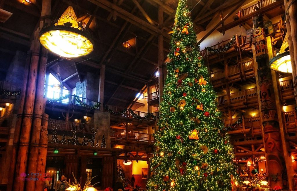 Large Christmas Tree in Disney Wilderness Lodge. Keep reading to learn about the best Disney Resorts at Christmas!