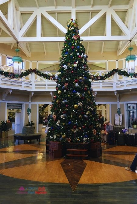 Port Orleans Riverside Christmas Tree in the Lobby. Keep reading to learn about the best Disney Christmas trees!