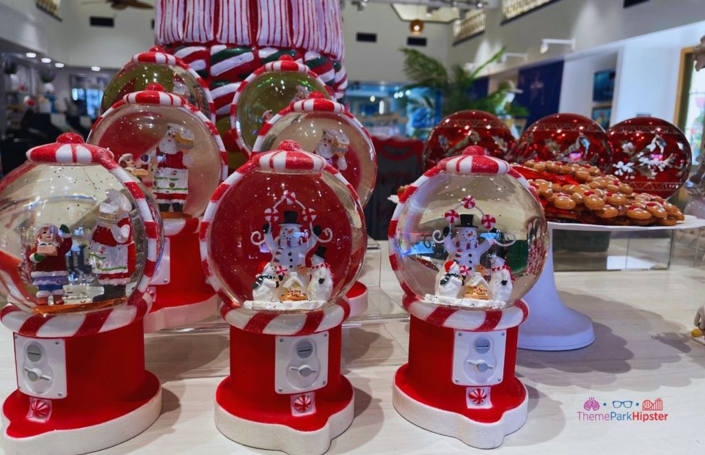 SeaWorld Christmas Celebration Holiday Store with Snowman in snow globe. Keep reading to learn about Christmas at SeaWorld Orlando!