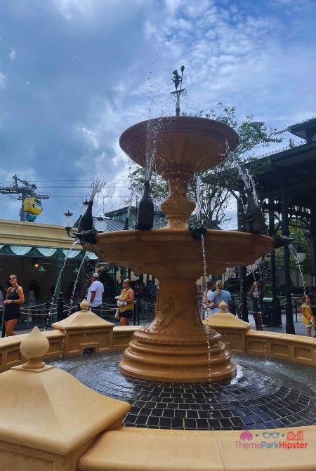 Remy’s Water fountain with Disney Skyliner in the Background Epcot. Keep reading to get the full Disney World Skyliner Guide with the Cost, Hours, Tips and more!
