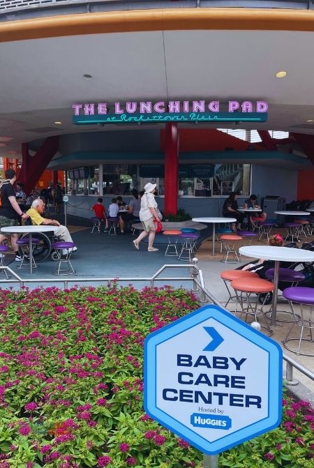 Tomorrowland Lunching Pad at Rockettower Plaza with Baby Care Center Sign Magic Kingdom