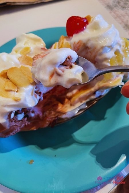 Disney Beach Club Resort Hotel Banana Split with Chocolate Strawberry and Vanilla Ice Cream topped with almonds whipped cream and cherries at Disney's Beaches and Cream Soda Shop.