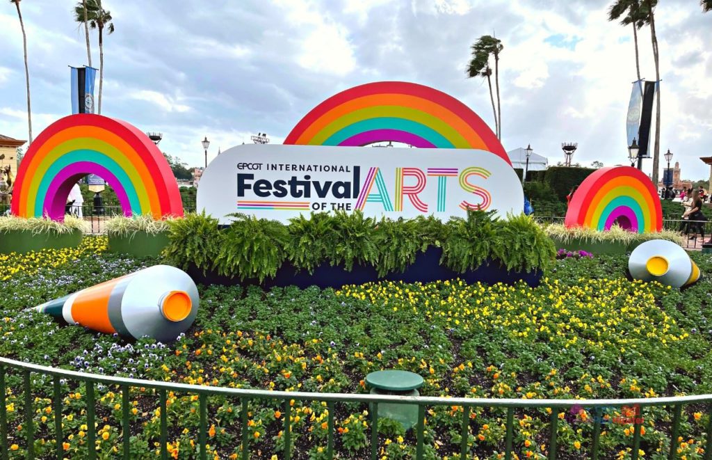 Epcot International Festival of the Arts 2022 Large Yellow and Orange Painting on Grass. One of the best Epcot Festivals at Disney World!