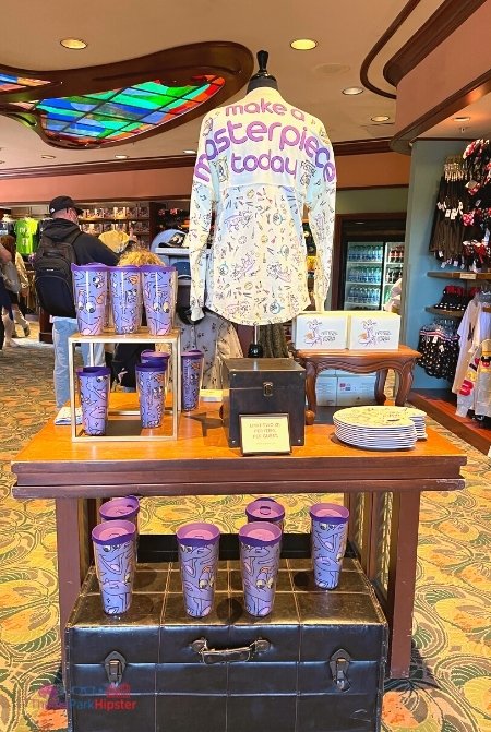 Epcot International Festival of the Arts 2022 Merchandise Figment Spirit Jersey and Tumbler. Keep reading to get the best Disney World souvenirs to buy for your trip!