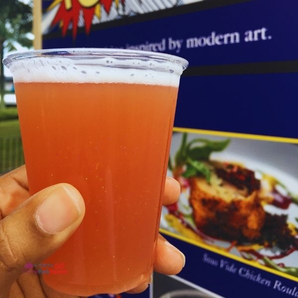 Glitter Beer from Pop Eats at Epcot Festival of the Arts. Keep reading to get the full Epcot Festival of the Arts Menu!