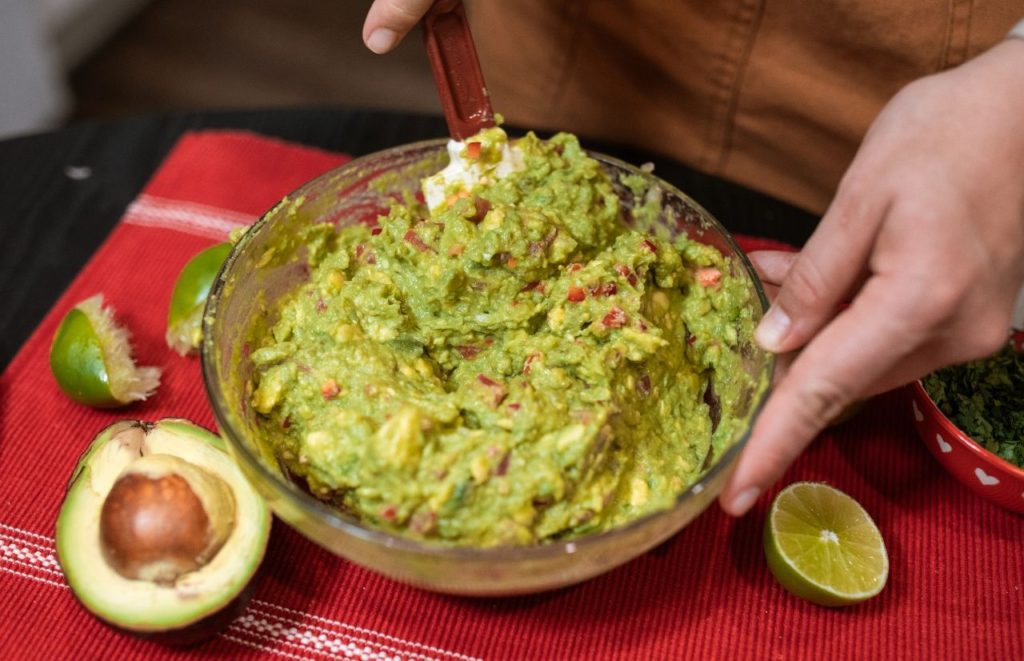 Guacamole being made table side at Antojito's Authentic Mexican Restaurant in Citywalk. Keep reading to learn about the best Universal Orlando Resort restaurants for solo travelers.
