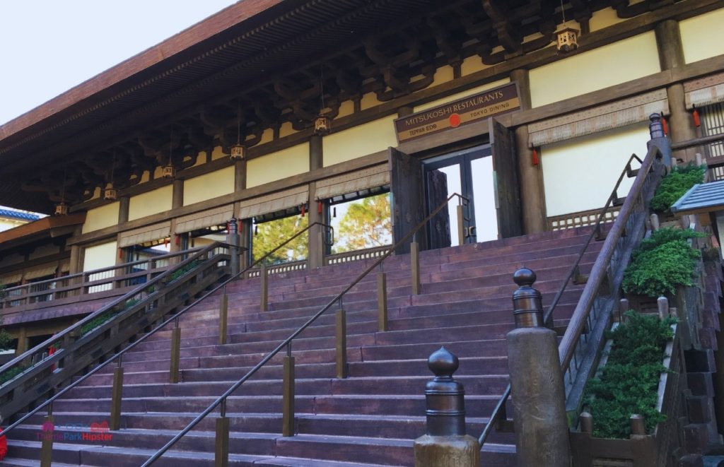 Japan Pavilion at Epcot Stairs leading to Mitsukoshi Restaurants Teppan Edo and Tokyo Dining. Keep reading to find out which EPCOT Japanese Restaurant is the BEST?