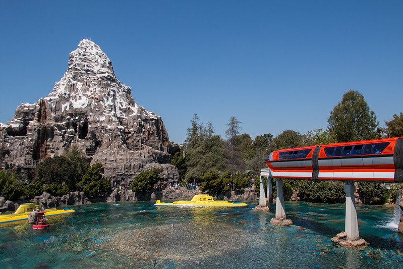 Disneyland Monorail near the Matterhorn passing over Nemo Submarine ride to Tomorrowland Station