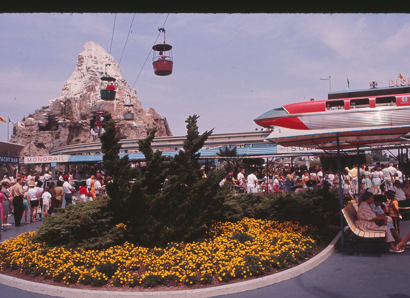 Disneyland Monorail passing by Matterhorn Ride in 1963. Keep reading to figure out which is better for Space Mountain Disneyland vs Disney World.