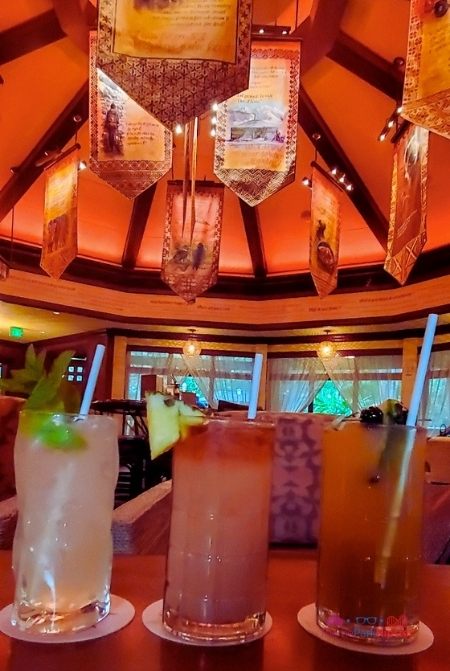 Three cocktails lined up on the table at Nomad Lounge in Animal Kingdom. Keep reading to find out the best things to do at Disney World for adults.