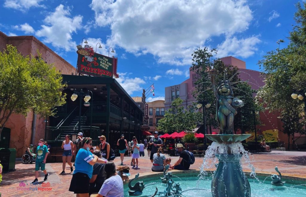 Disney Hollywood Studios Miss Piggy Muppet Water Fountain in front of PizzeRizzo. Keep reading to know what to pack and what to wear to Disney World in August for your packing list.