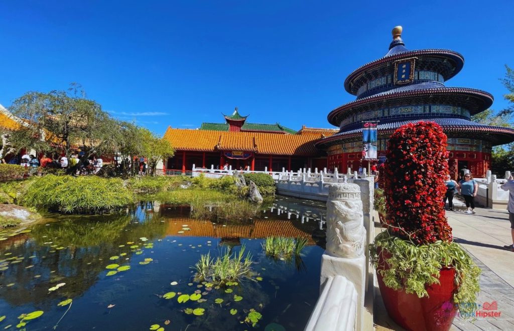 Epcot China Pavilion Chinese Temple overlooking pond. Epcot flower and garden concerts. Garden Rocks.