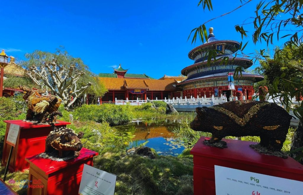 Epcot China Pavilion Chinese Temple overlooking the lagoon. Disney Solo Trip to the Epcot Flower and Garden Festival 2024. Keep reading to learn how to go to Epcot Flower and Garden Festival alone and how to have the perfect solo Disney World trip.