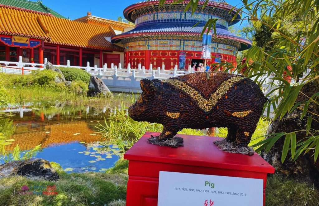 Epcot China Pavilion Year of the Pig Sculpture in front of Chinese Temple