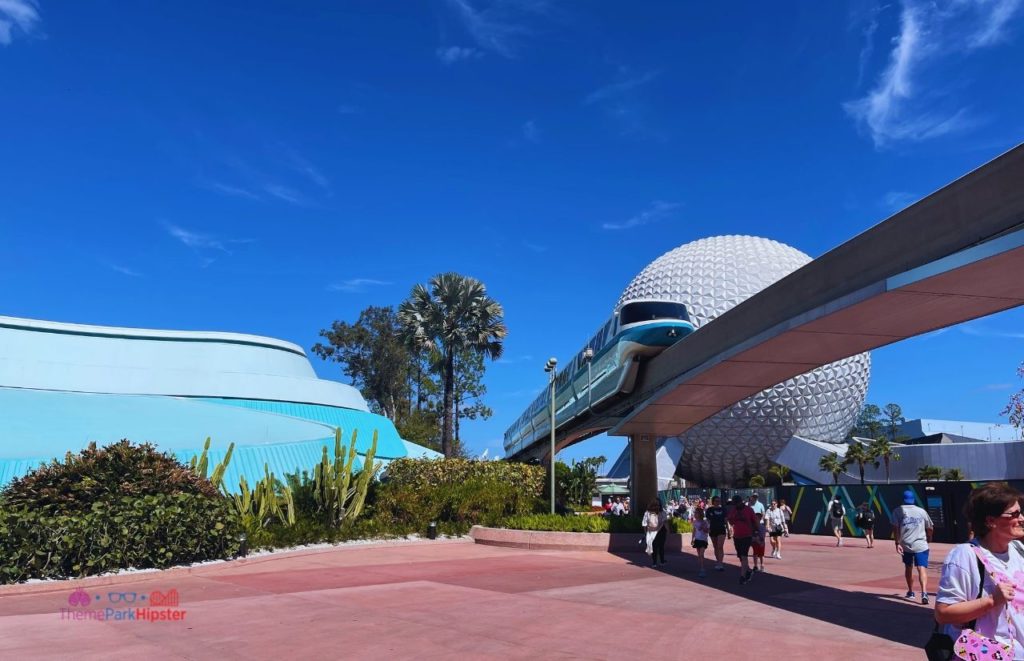 Epcot Flower and Garden Festival Spaceship Earth with monorail passing by. Keep reading for you perfect Disney World itinerary.