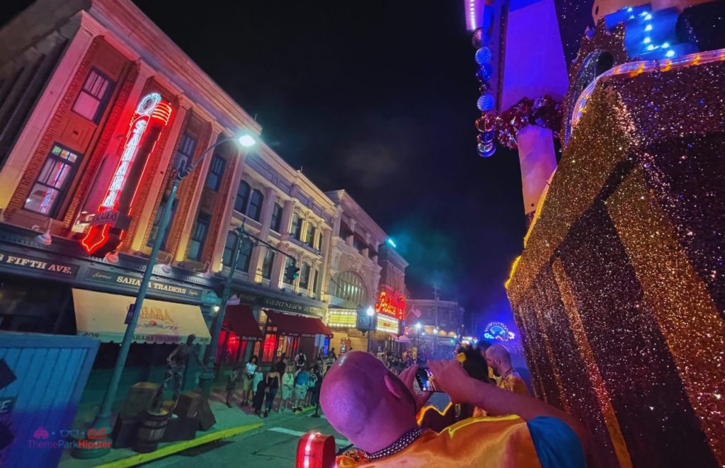 Machine Float in Universal Studios Mardi Gras Parade in front of the Mummy ride construction Sahara Traders. Keep reading to get the best things to do at Universal Orlando solo trip while going to Universal alone.