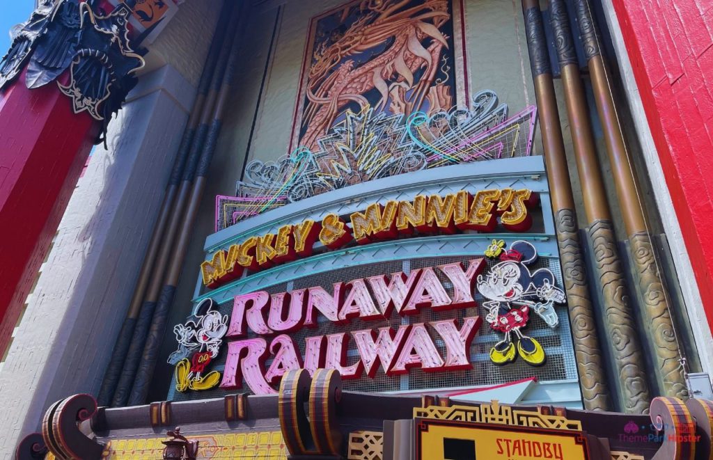 Mickey and Minnie’s Runaway Railway Entrance with colorful marque. Keep reading about Mickey and Minnie's Runaway Railway at Disneyland vs Disney World.