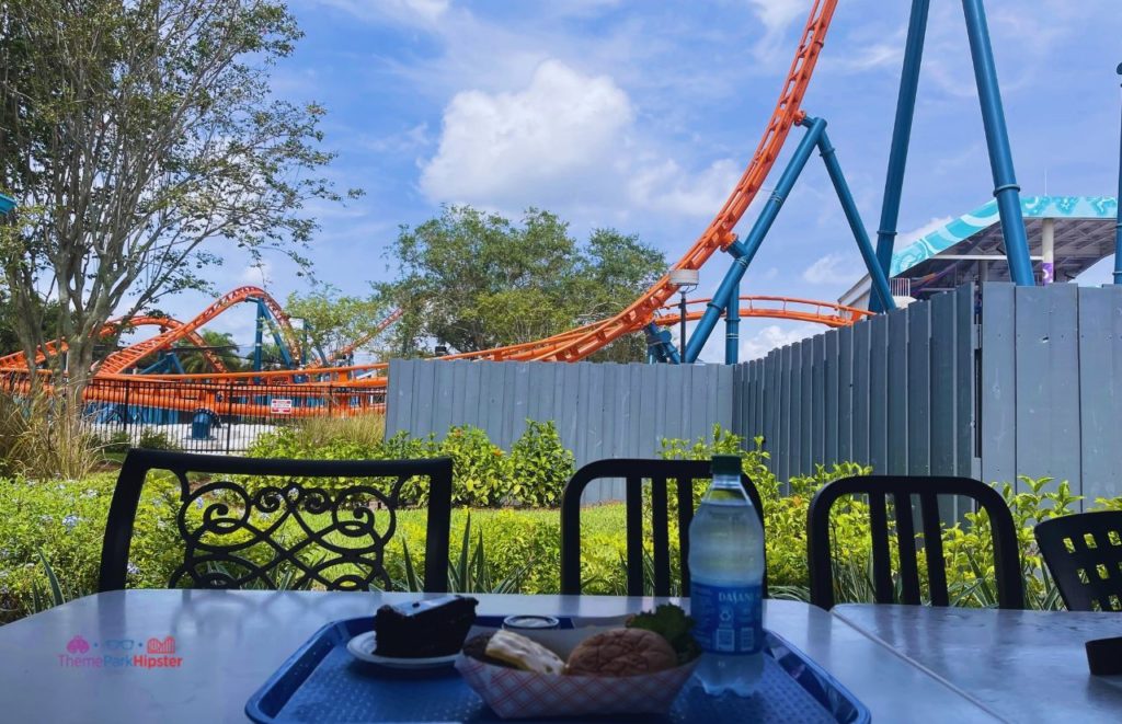 SeaWorld Orlando Altitude Burger food in front of Icebreaker. Keep reading to learn more about the best SeaWorld Orlando restaurants.