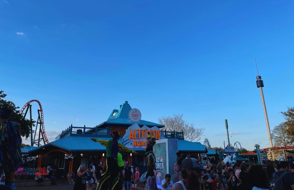 SeaWorld Orlando Altitude Burgers with Skytower in the evening. Keep reading to learn if the SeaWorld All Day dining plan is worth it.