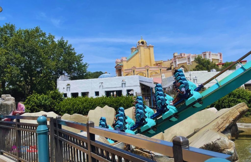SeaWorld Orlando Kraken Roller Coaster with Journey to Atlantis in the Background. Keep reading to learn how to avoid with SeaWorld wait times with quick queue skip the line pass.