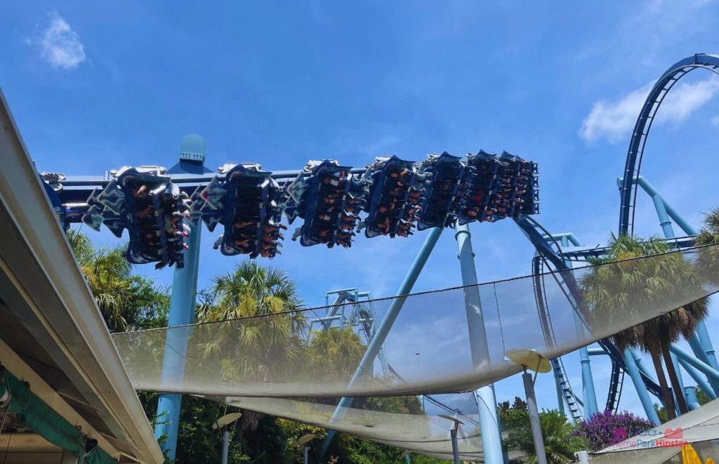 SeaWorld Orlando Manta Rollercoaster flying over in the sky. Keep reading to learn how to avoid with SeaWorld wait times with quick queue skip the line pass.