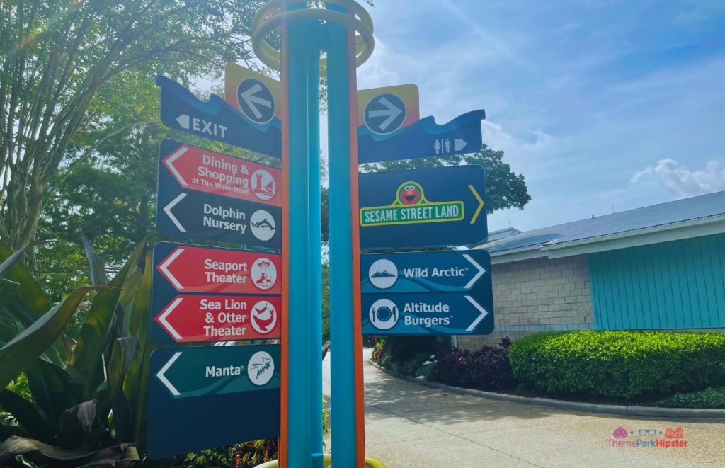 SeaWorld Orlando signs to the attractions. Keep reading to learn more about Sharks Underwater Grill at SeaWorld Orlando.
