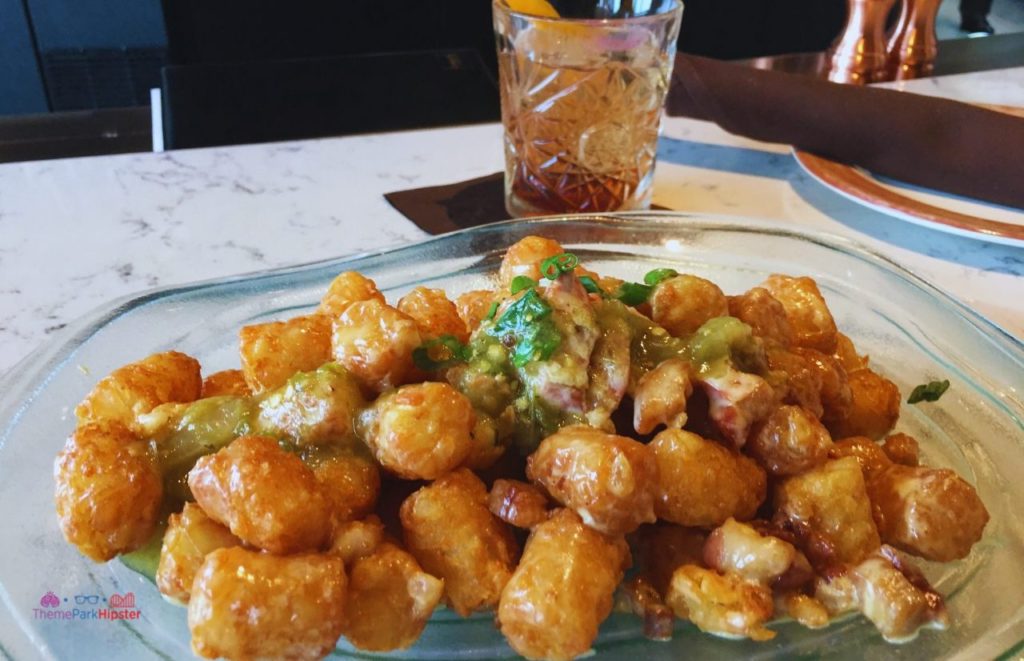 Toothsome Chocolate Emporium Loaded Tater Tots next to Manhattan. Keep reading for the full female guide to solo travel.