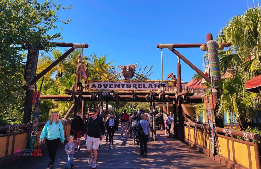 Disney Magic Kingdom Adventureland entrance going over the bridge. Keep reading to learn about Magic Kingdom for adults the Disney grown up way.