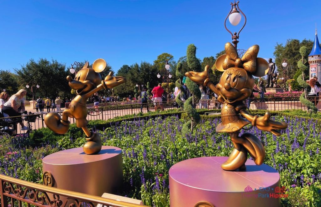 Disney Magic Kingdom Mickey Mouse and Minnie Mouse 50th Anniversary Statues. Keep reading to know what the best days to visit Disney World parks and how to use the Disney World Crowd Calendar.