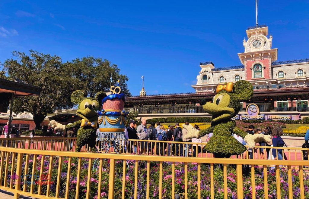 Disney Magic Kingdom Mickey Mouse and Minnie Mouse 50th Anniversary Topiaries. Keep reading to know what to wear to Disney World in May and what to pack for Disney World in May.