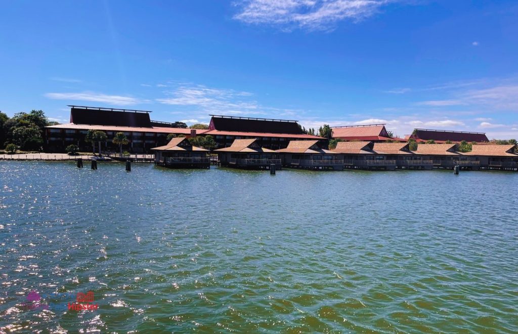 Polynesian Resort Bungalows overlooking lagoon at Disney Magic Kingdom. Keep reading to find out more about the best place to watch Magic Kingdom fireworks. 