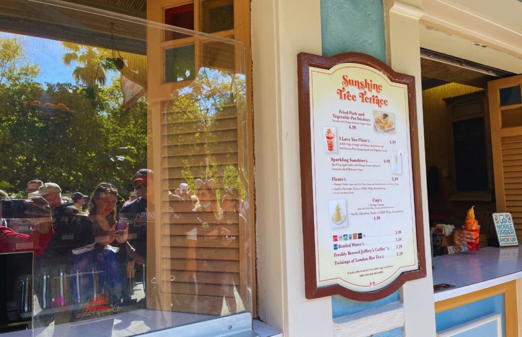 Disney Magic Kingdom Sunshine Tree Terrace Menu in Adventureland with Dole Whip. Keep reading to know what to pack and what to wear to Disney World in July for your packing list.