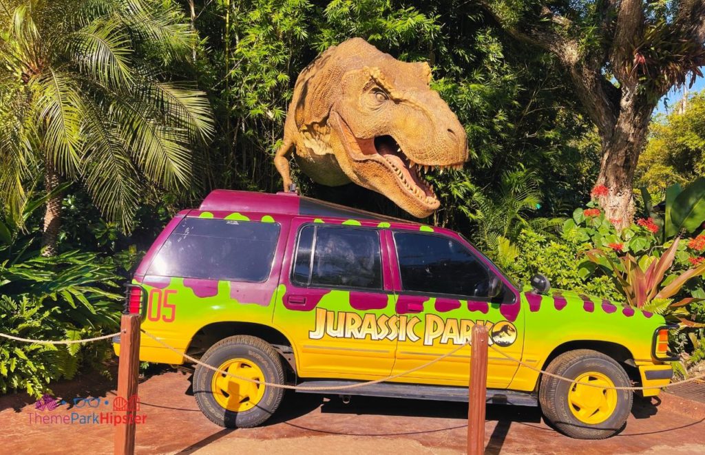 Universal Islands of Adventure Jurassic Park Jeep with T Rex Dinosaur coming out of the bushes