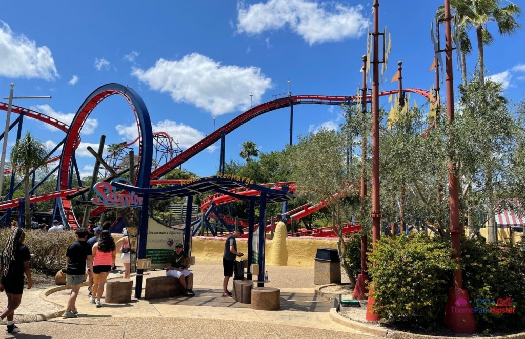 Busch Gardens Tampa Bay scorpion in florida sun next to charging station. Keep reading to learn how to find cheap Busch Gardens tickets.