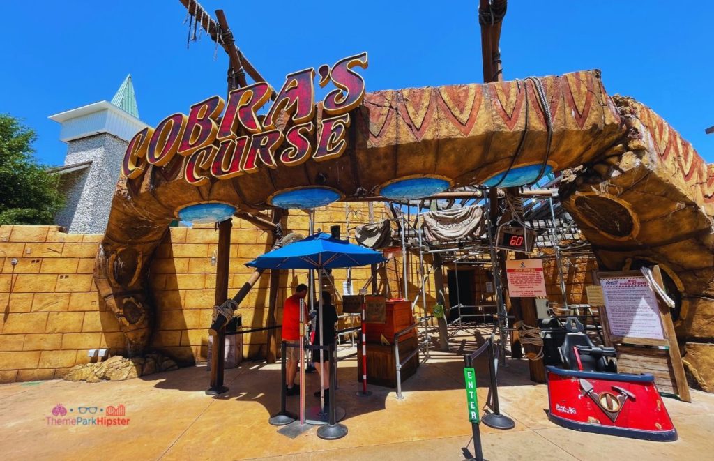 Busch Gardens Tampa Cobra's Curse Entrance with guests standing at the entrance. Keep reading to discover what are the best hotels near Busch Gardens Tampa.