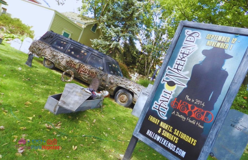 Cedar Point Halloweekends sign with station wagon. Keep reading for more Cedar Point tips and tricks for beginners.