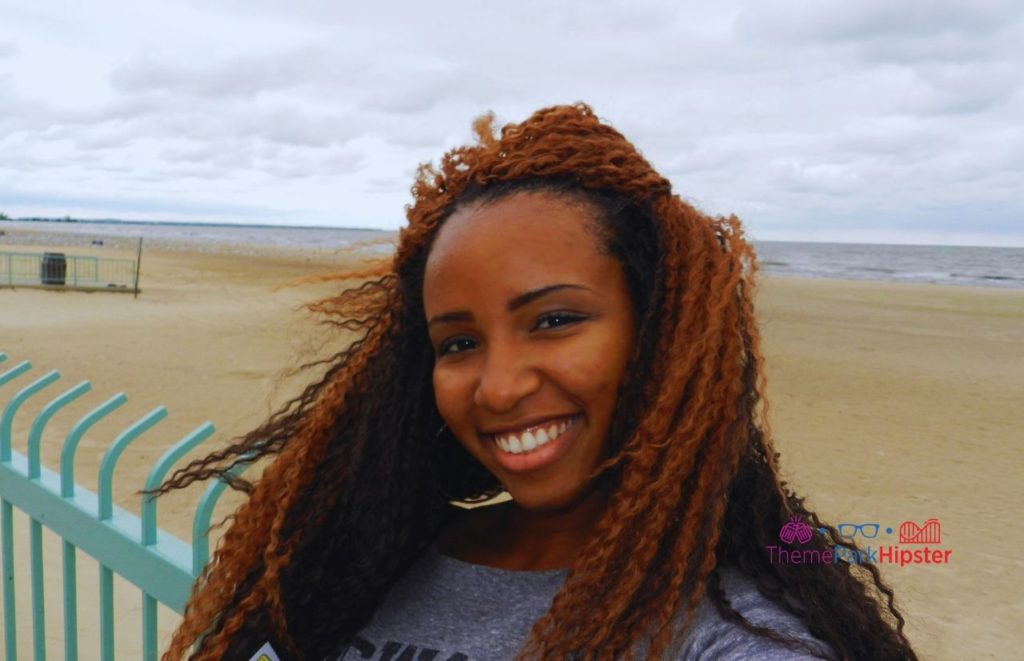 NikkyJ in front of Lake Eerie at Hotel Breakers. Read more to find out the best things to do at Cedar Point. 