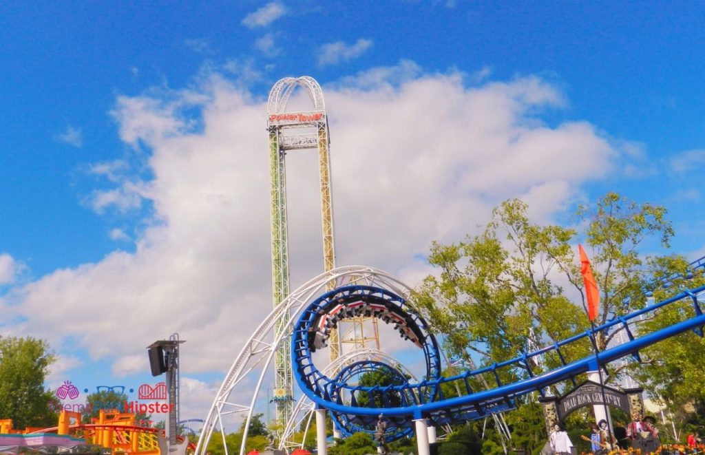 Cedar Point Power Tower behind Corkscrew roller coaster. Keep reading to find out all you need to know about Cedar Point Season Pass. 