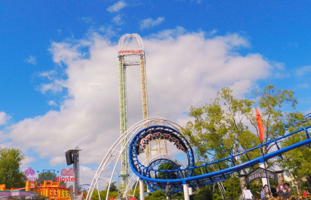 Cedar Point Power Tower behind Corkscrew roller coaster. Keep reading to learn about the best Cedar Point roller coasters ranked!