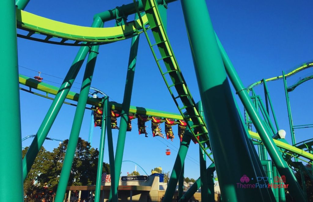 Cedar Point Raptor roller coaster going by. Keep reading to learn about the best Cedar Point roller coasters ranked!